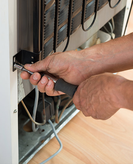 close-up-of-a-technicians-hands-during-refrigerator-repair-fort-collins-co