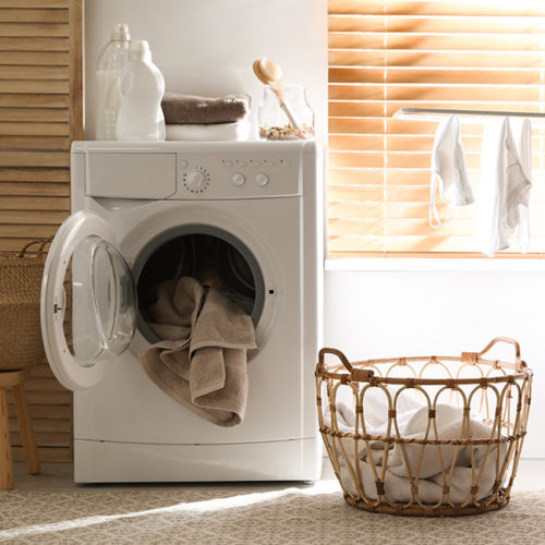 front-view-of-a-dryer-machine-with-clothes-and-towels-inside-fort-collins-co
