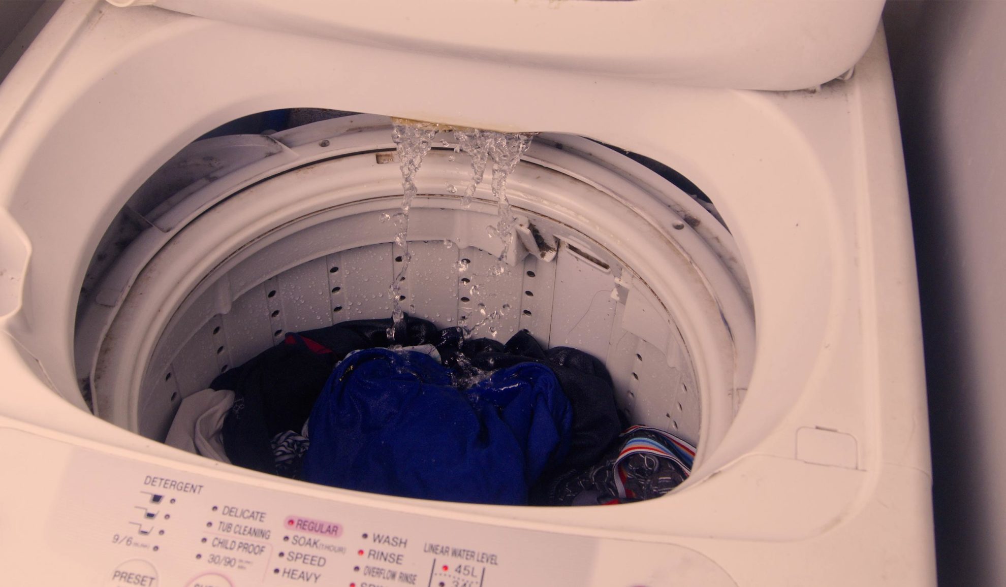 washer-machine-opened-with-clothes-inside-and-getting-filled-with-water-fort-collins-co